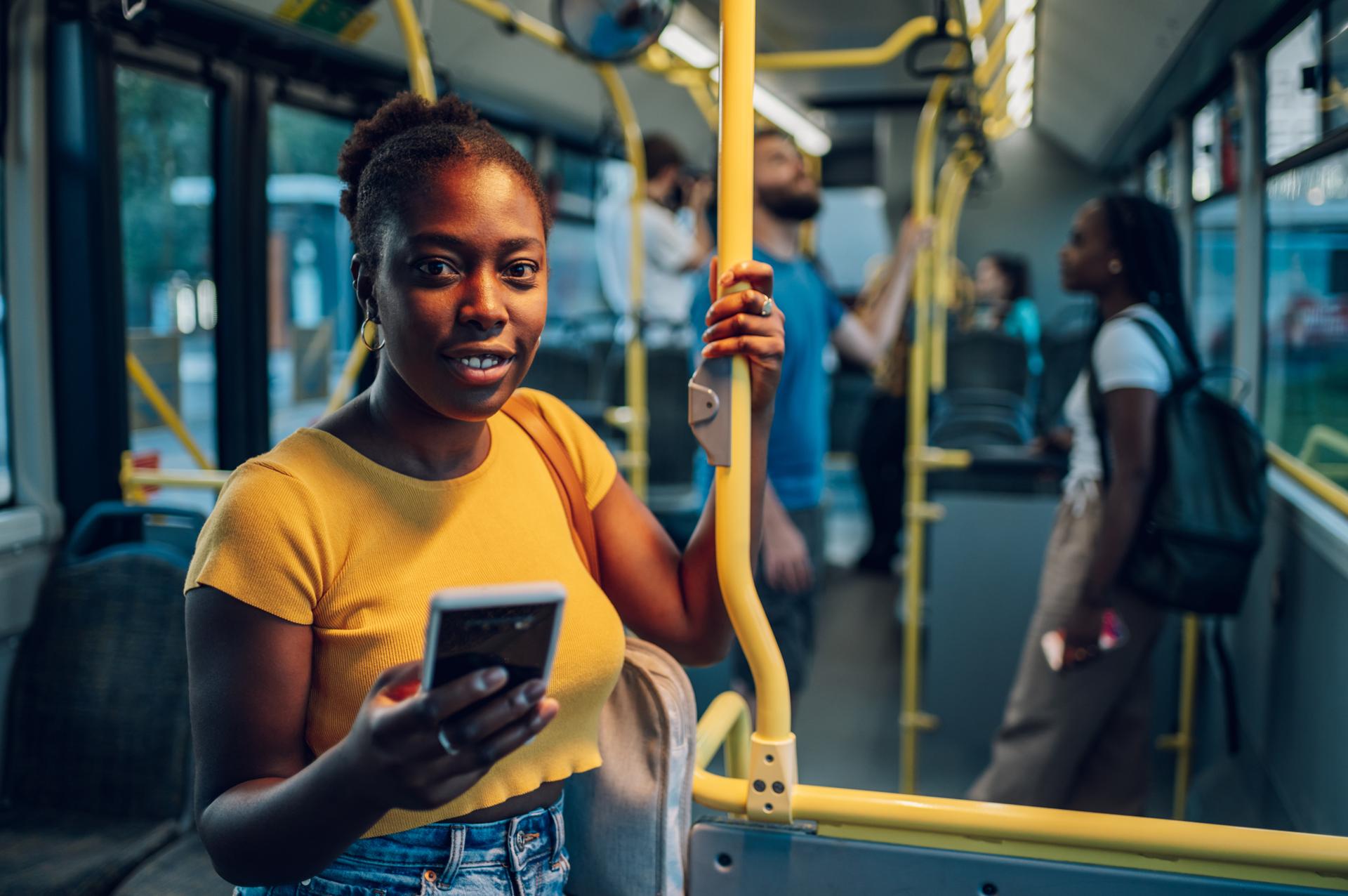 Happy woman customer on a Tranzbook bus
